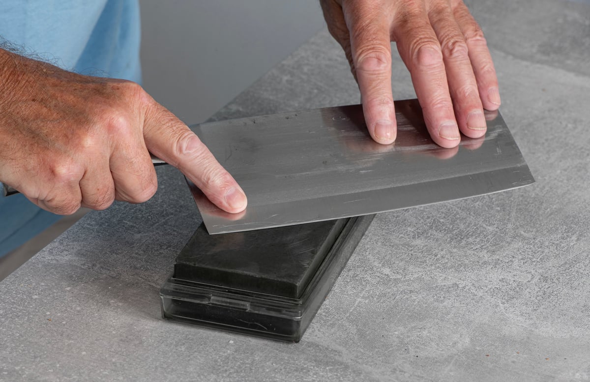 Sharpening a cleaver on a wet stone